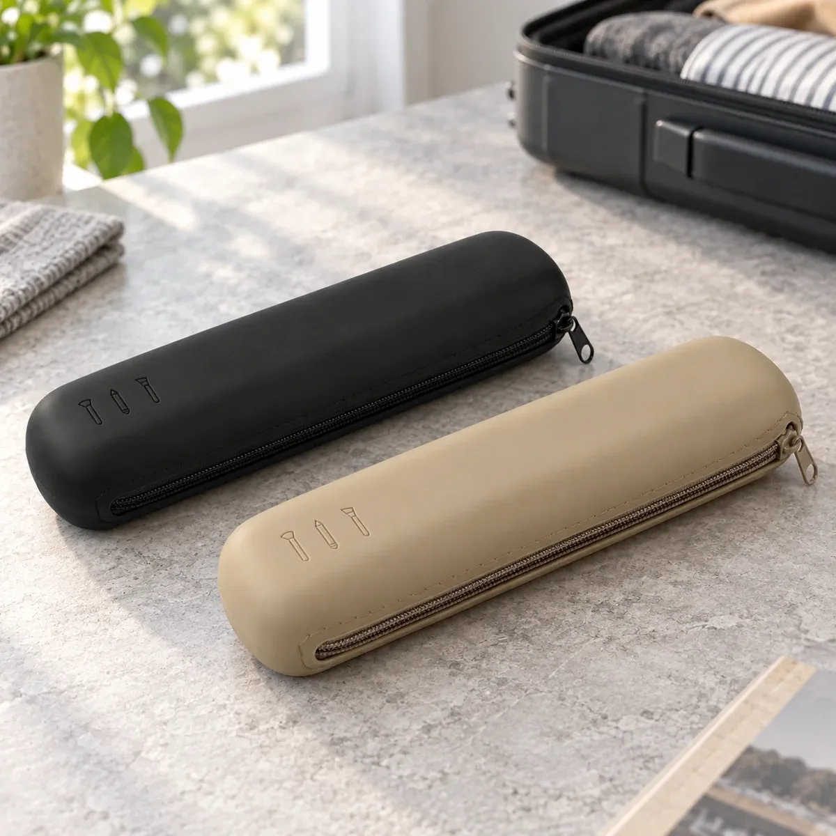 Black and khaki silicone brush cases — lead view. Makeup brushes and styling props are not included.